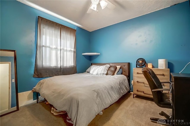 bedroom with light colored carpet and ceiling fan