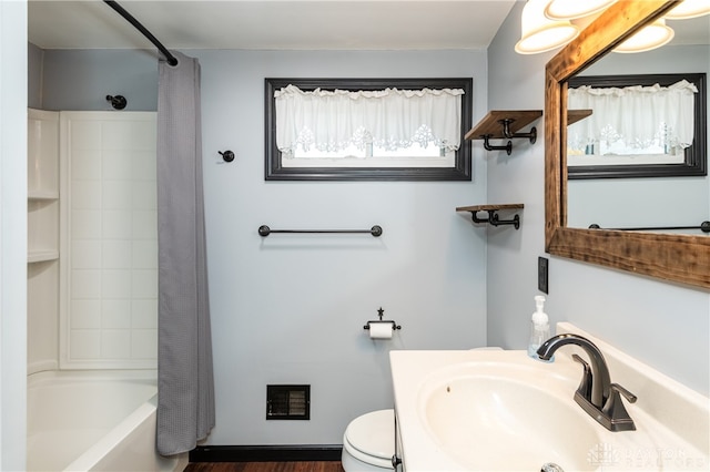 full bathroom with toilet, hardwood / wood-style floors, shower / tub combo with curtain, and sink