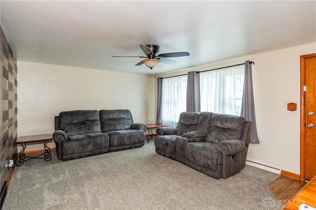 living room featuring carpet flooring, ceiling fan, and a baseboard heating unit