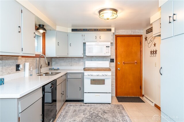 kitchen with sink, a baseboard radiator, tasteful backsplash, white appliances, and light tile patterned flooring