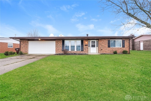 ranch-style house featuring a front lawn and a garage