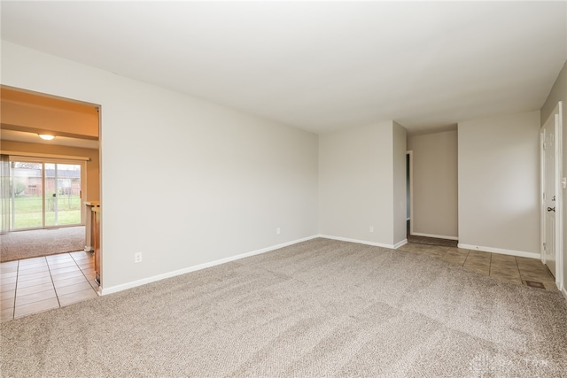 unfurnished room featuring carpet flooring