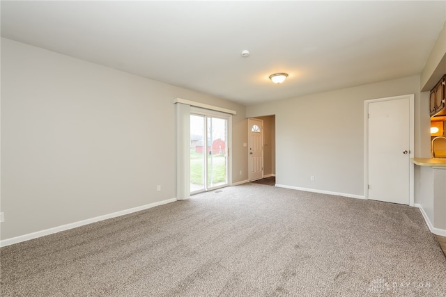 unfurnished room featuring carpet