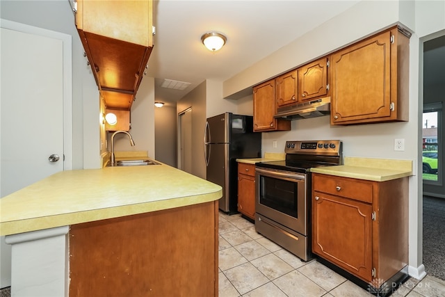 kitchen featuring light tile patterned flooring, sink, and appliances with stainless steel finishes