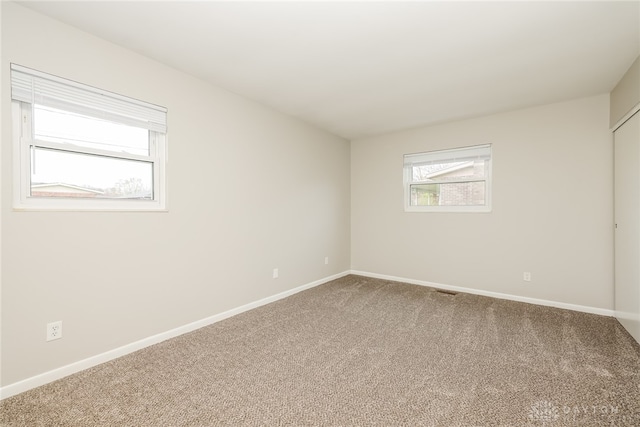 unfurnished room with carpet