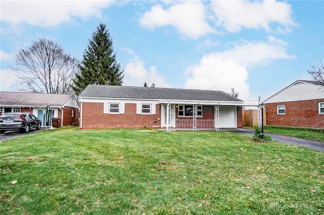 ranch-style home with a porch and a front yard