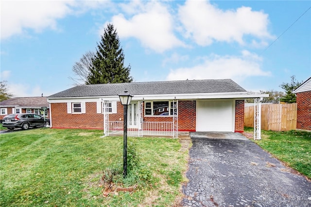 ranch-style home with a porch, a garage, and a front lawn