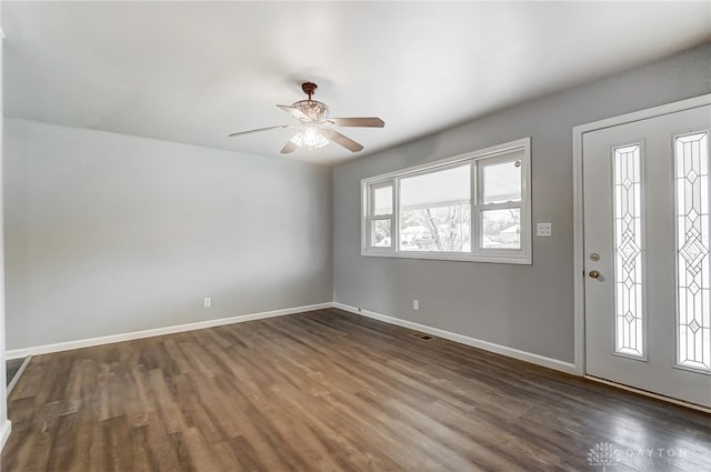 entryway with ceiling fan and dark wood-type flooring