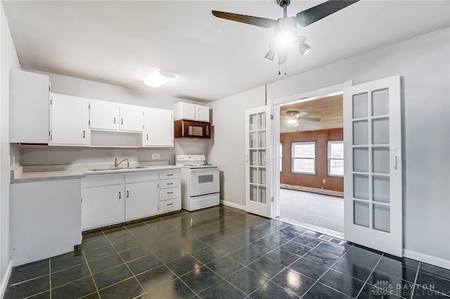 kitchen with french doors, white electric range oven, sink, a baseboard radiator, and white cabinets