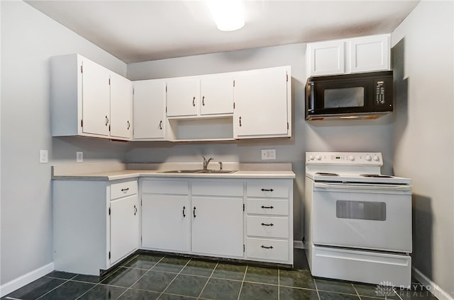 kitchen featuring white cabinets, dark tile patterned flooring, white range with electric stovetop, and sink