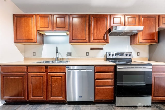 kitchen with dark hardwood / wood-style flooring, sink, and appliances with stainless steel finishes