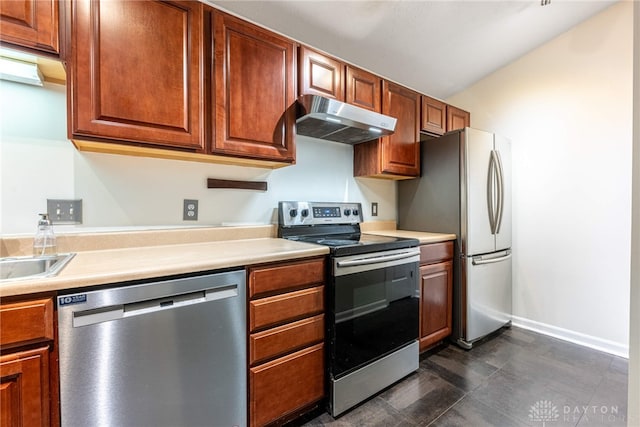 kitchen featuring stainless steel appliances and extractor fan