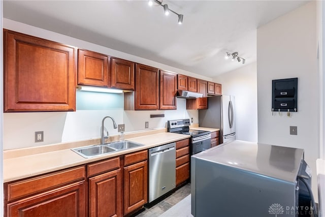 kitchen with rail lighting, sink, and appliances with stainless steel finishes