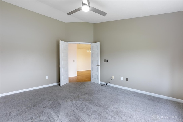 unfurnished room featuring ceiling fan and carpet floors