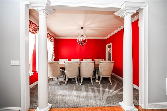 carpeted dining room featuring an inviting chandelier, ornamental molding, and ornate columns