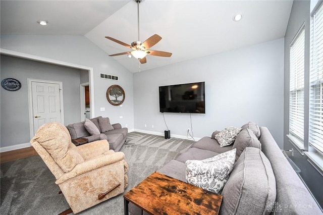 living room featuring ceiling fan and lofted ceiling