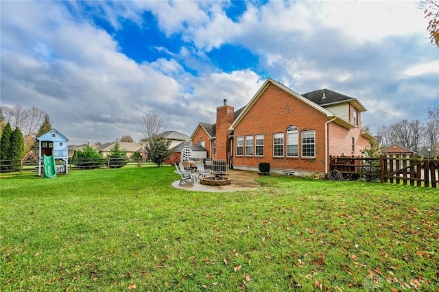 exterior space featuring a fire pit, a patio, and a playground