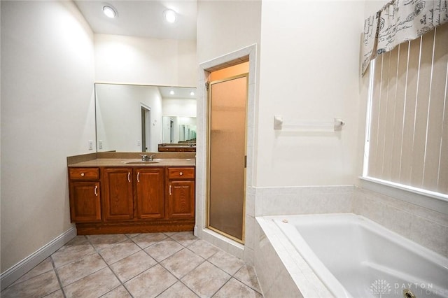 bathroom with vanity, shower with separate bathtub, and tile patterned floors