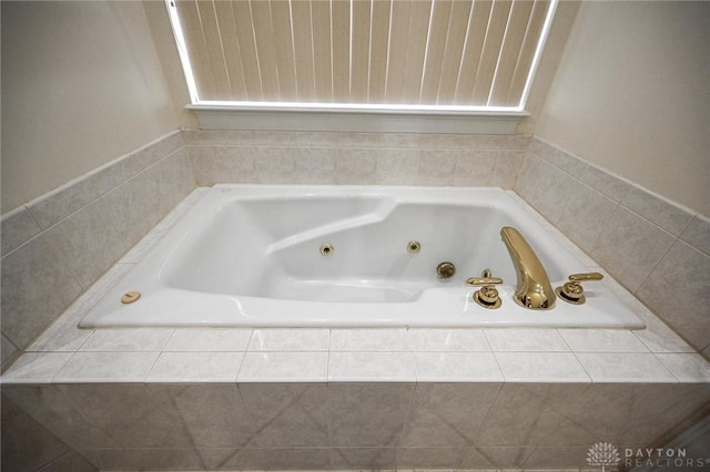 bathroom with tiled bath