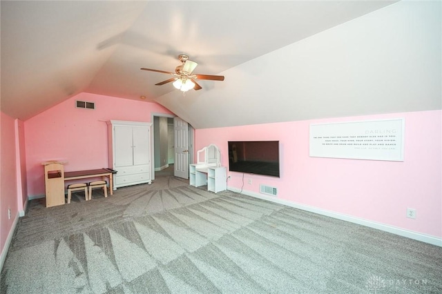 additional living space with ceiling fan, lofted ceiling, and carpet floors