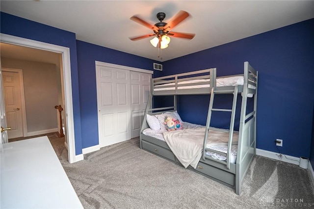 bedroom featuring carpet, ceiling fan, and a closet