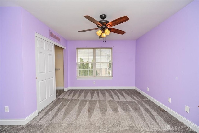 unfurnished bedroom featuring carpet floors and ceiling fan