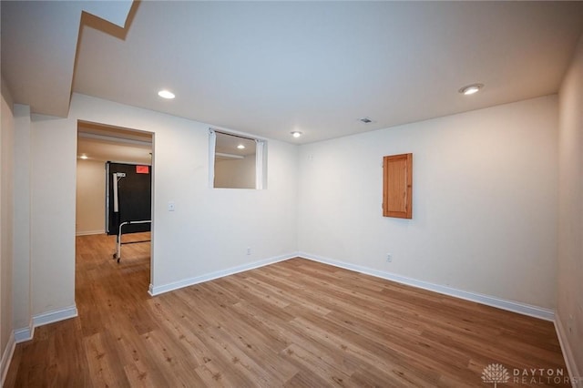 spare room featuring light hardwood / wood-style flooring