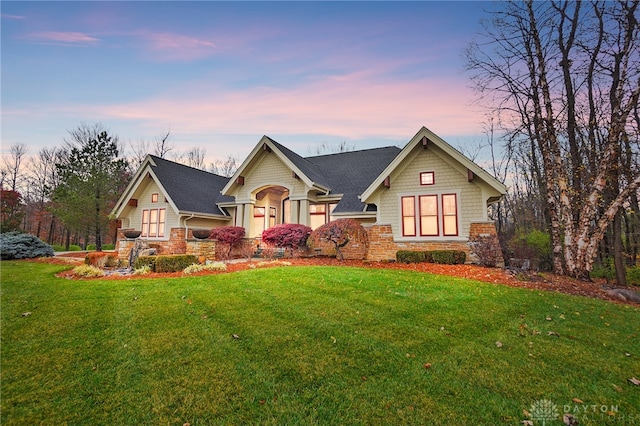 craftsman house with a yard