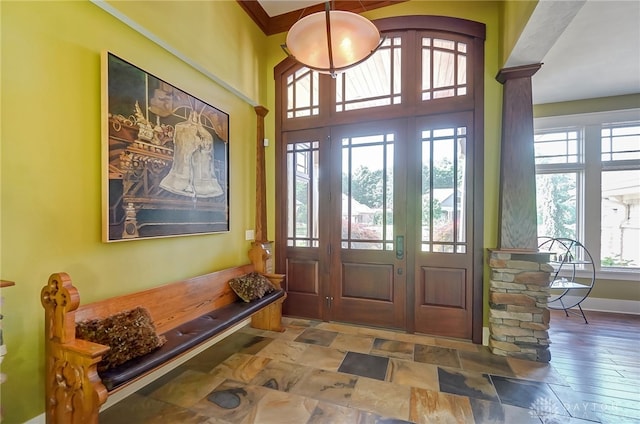 foyer featuring ornamental molding