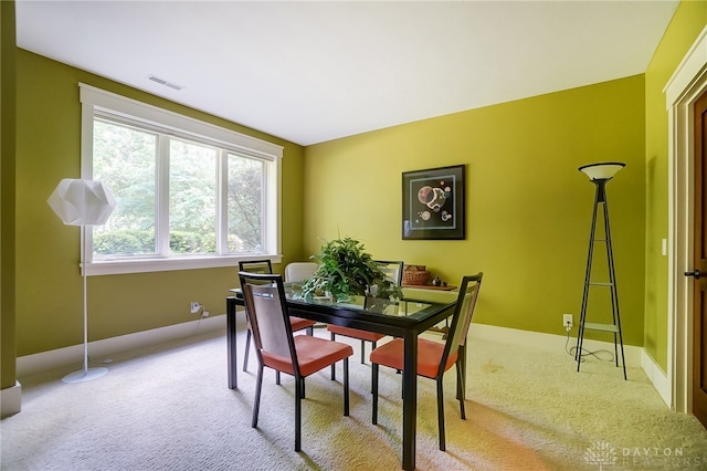 dining area with light colored carpet