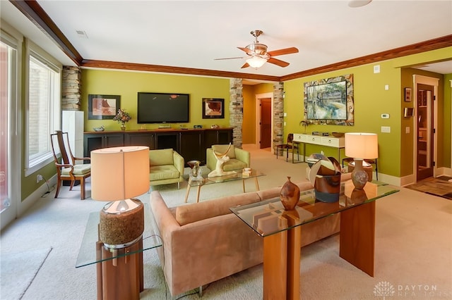 carpeted living room featuring ceiling fan and ornamental molding