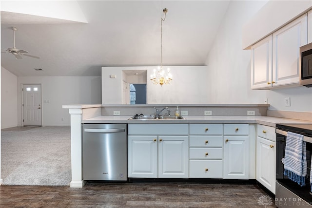 kitchen featuring sink, dark hardwood / wood-style floors, white cabinets, ceiling fan with notable chandelier, and appliances with stainless steel finishes