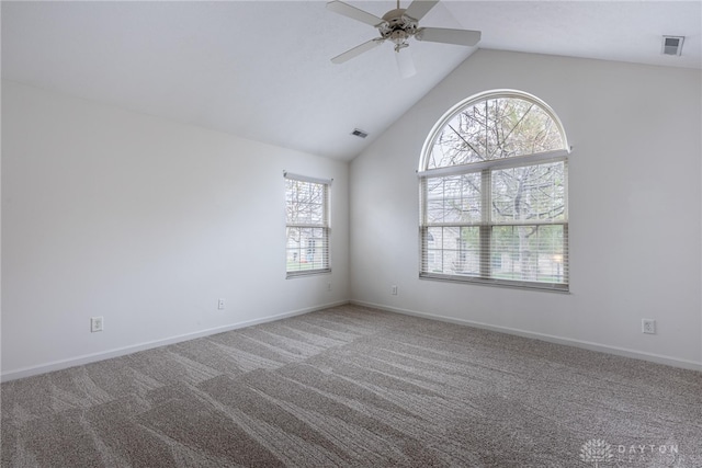 unfurnished room with carpet, ceiling fan, and vaulted ceiling