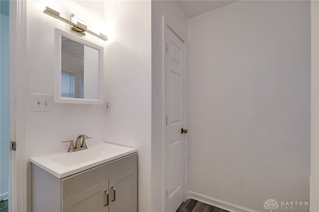 bathroom featuring wood-type flooring and vanity