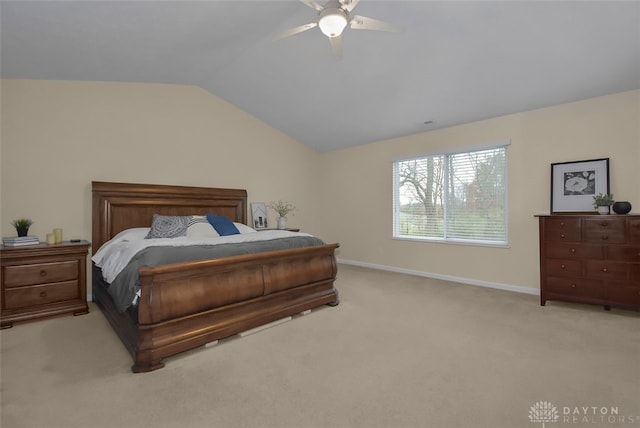 bedroom with light colored carpet, ceiling fan, and lofted ceiling