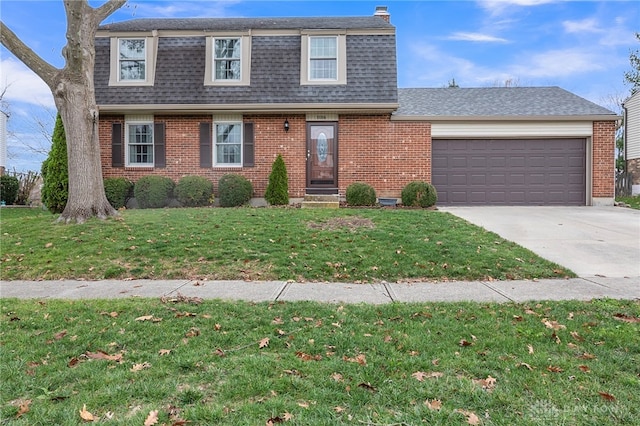 view of front of house featuring a front lawn and a garage