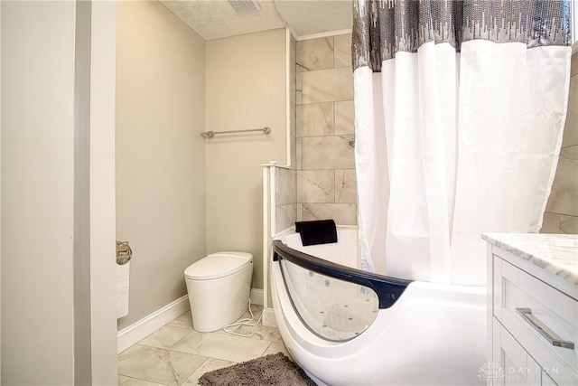 bathroom featuring toilet, vanity, a textured ceiling, and walk in shower