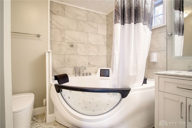 full bathroom featuring vanity, toilet, a textured ceiling, and shower / tub combo