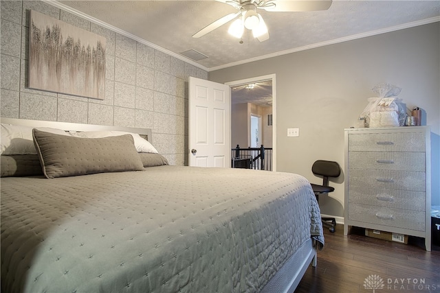 bedroom with dark hardwood / wood-style flooring, ceiling fan, crown molding, and tile walls