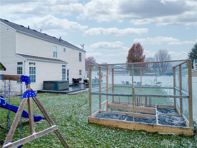 dock area featuring a playground and a lawn