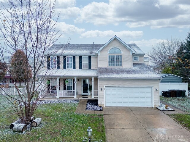 view of front of home with a porch and a garage