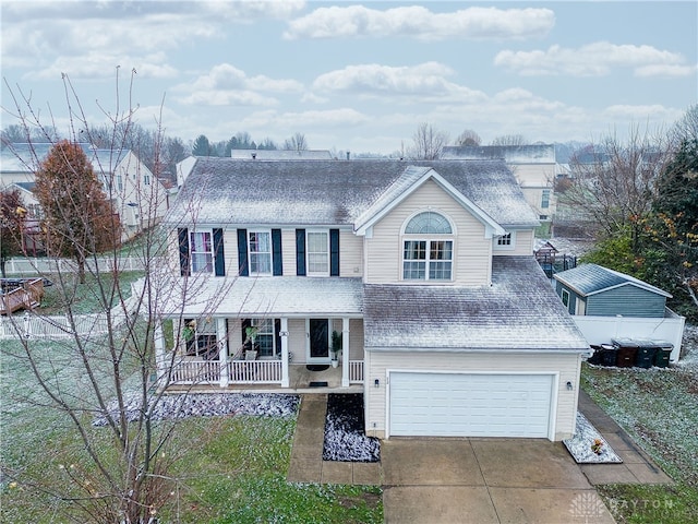 view of front of property featuring a porch and a garage