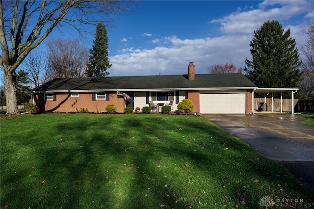 single story home featuring a front lawn and a garage