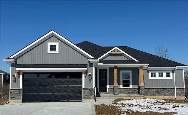 craftsman-style house featuring a porch, stone siding, board and batten siding, and concrete driveway