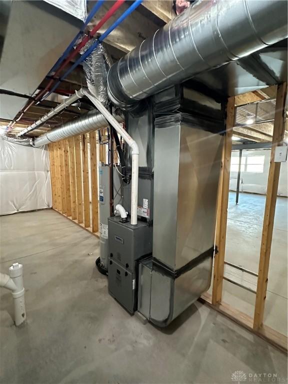 utilities featuring heating unit and electric water heater