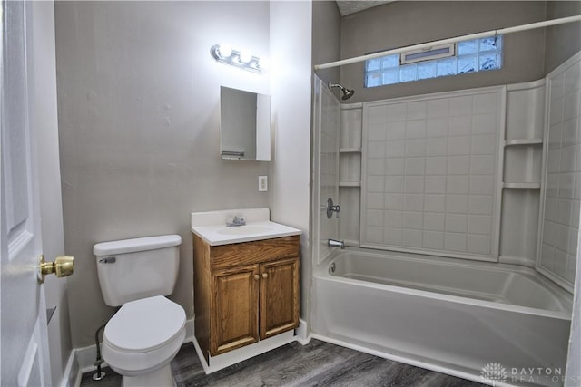 full bathroom featuring vanity, tub / shower combination, hardwood / wood-style floors, and toilet