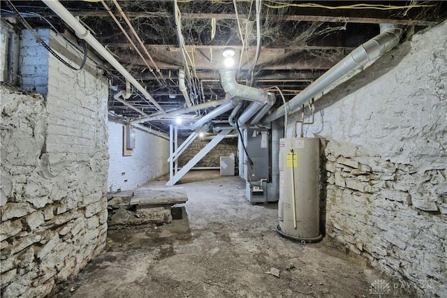 basement with heating unit, electric panel, and water heater