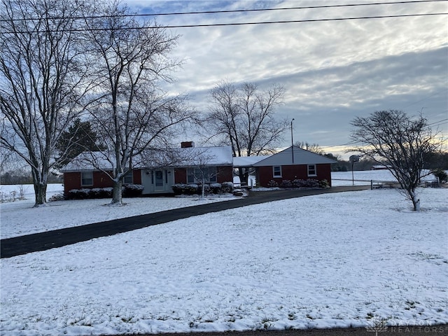 view of yard layered in snow