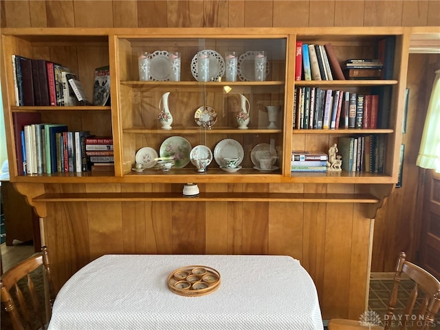 interior space featuring wooden walls