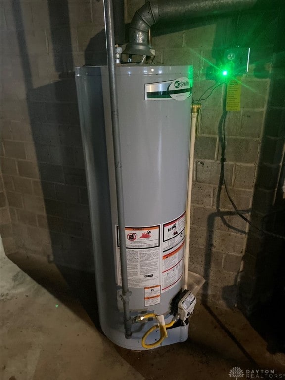 utility room featuring gas water heater